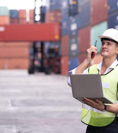 Engineer control loading Container box from Cargo freight ship import export, foreman control Industrial Container Cargo freight ship,
Business people transport Container in warehouse at industry zone